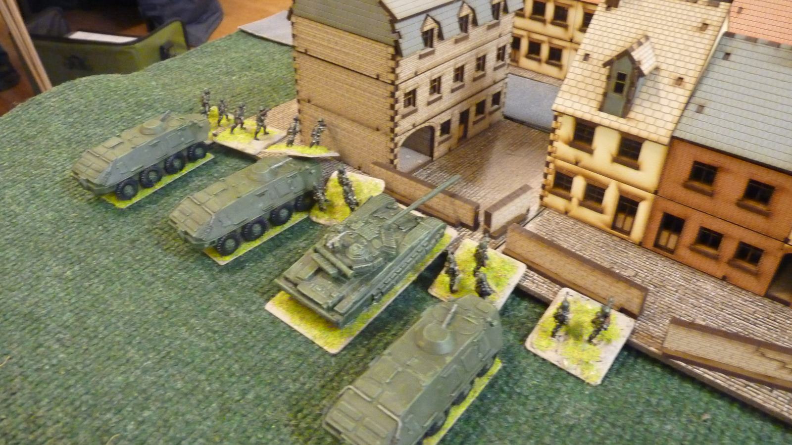 Soviet infantry dismount to storm the village
